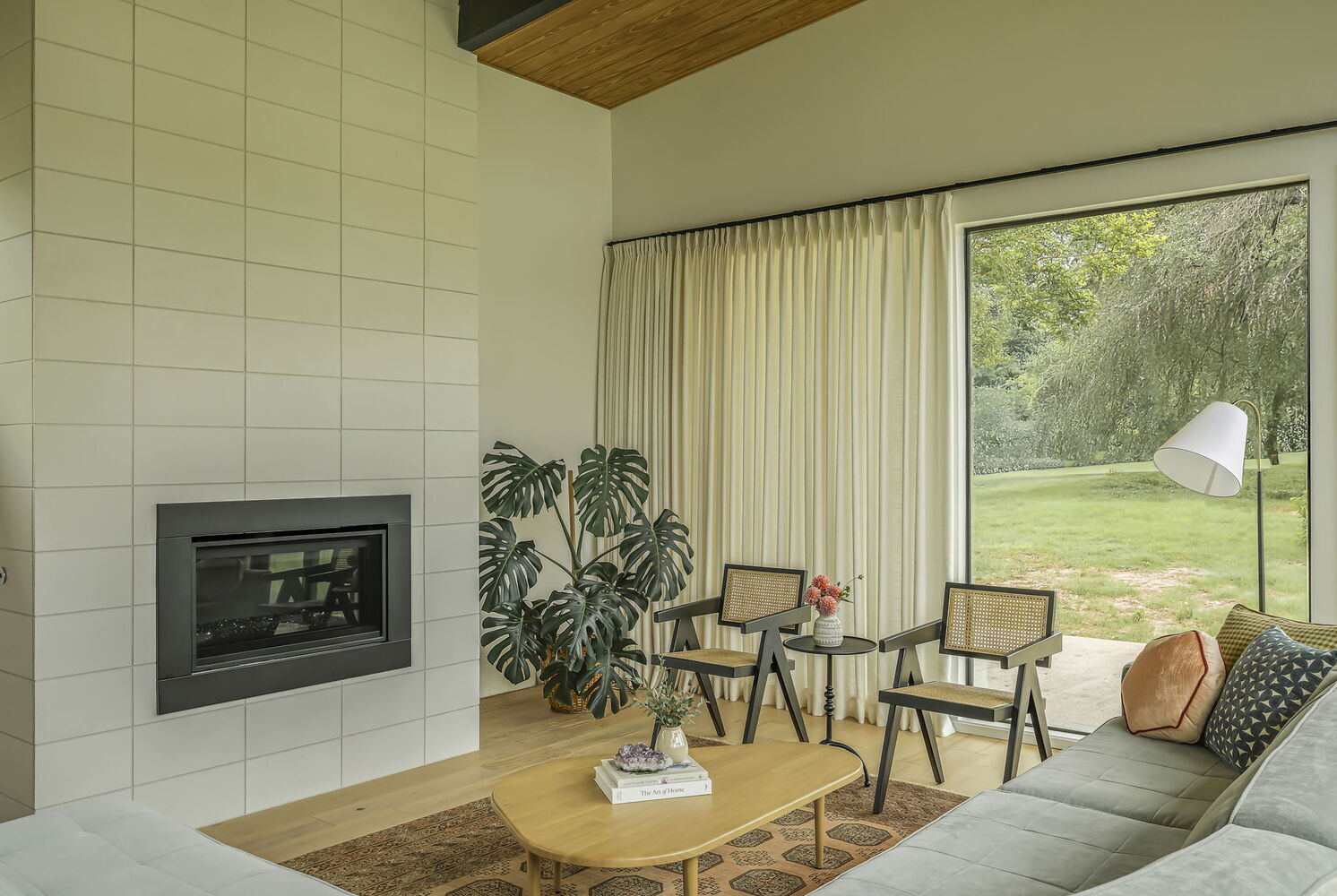 modern living room with fireplace and lounge chairs in RedOven Builds custom home San Juan Dr Rio Grande TX