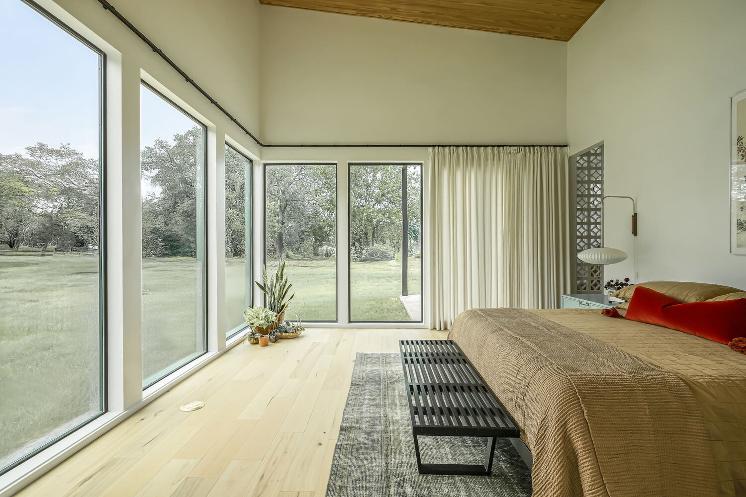 spacious bedroom with large windows and natural light in custom home by RedOven Builds Rio Grande TX