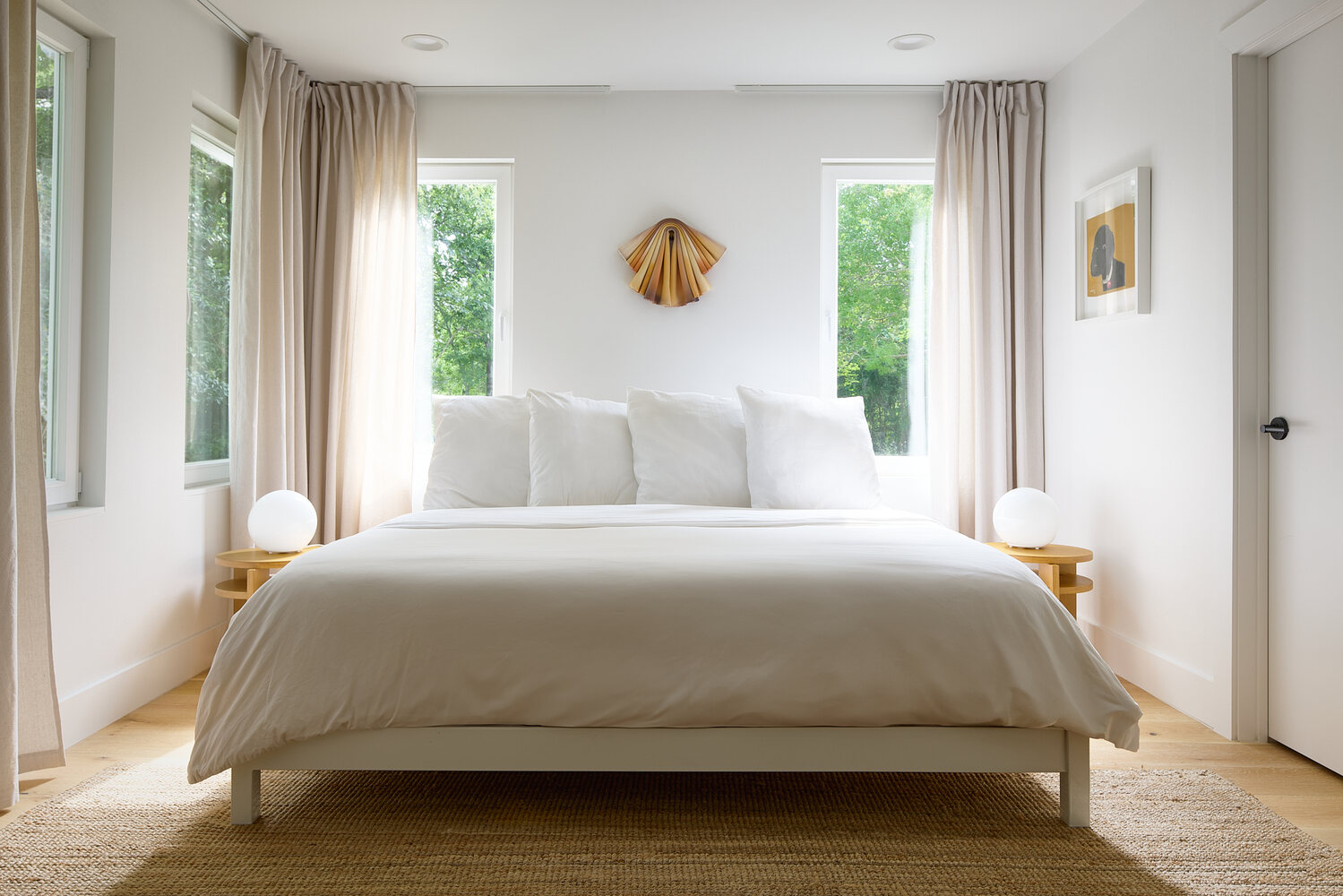 clean white bedroom from gut remodel project by RedOven Builds in Lockhart, TX