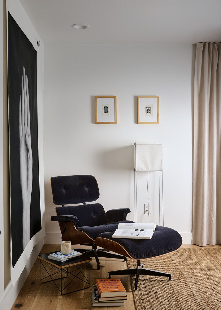 cozy interior seating area with wood floors and decor by RedOven Builds in Lockhart, TX