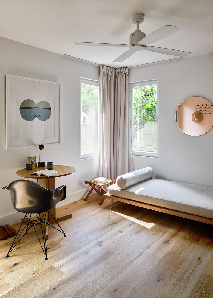 cozy reading nook and lounge space with wood flooring by RedOven Builds in Lockhart, TX