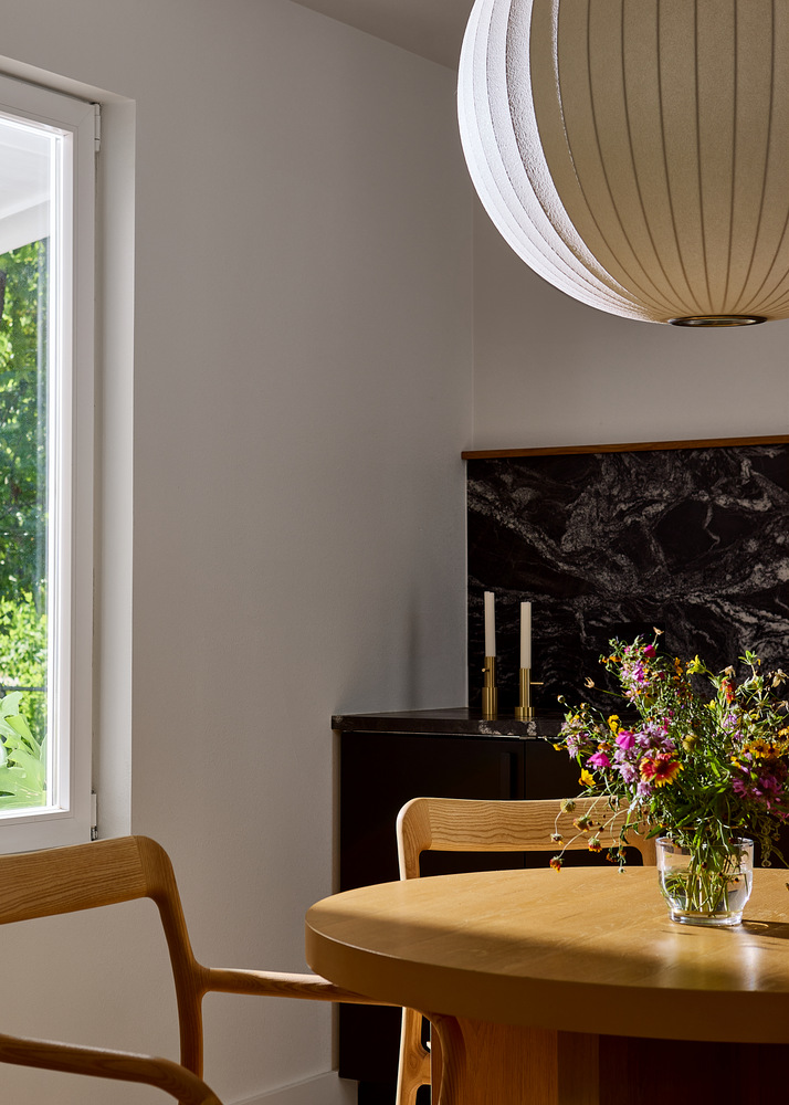 kitchen remodel with dark cabinets and wood dining chairs by RedOven Builds in Lockhart, TX