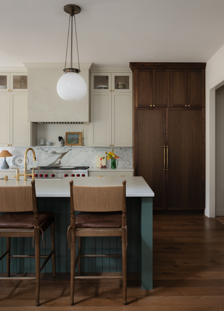 Close-up of custom kitchen design in Austin TX by RedOven Builds with pendant lighting and mixed cabinetry