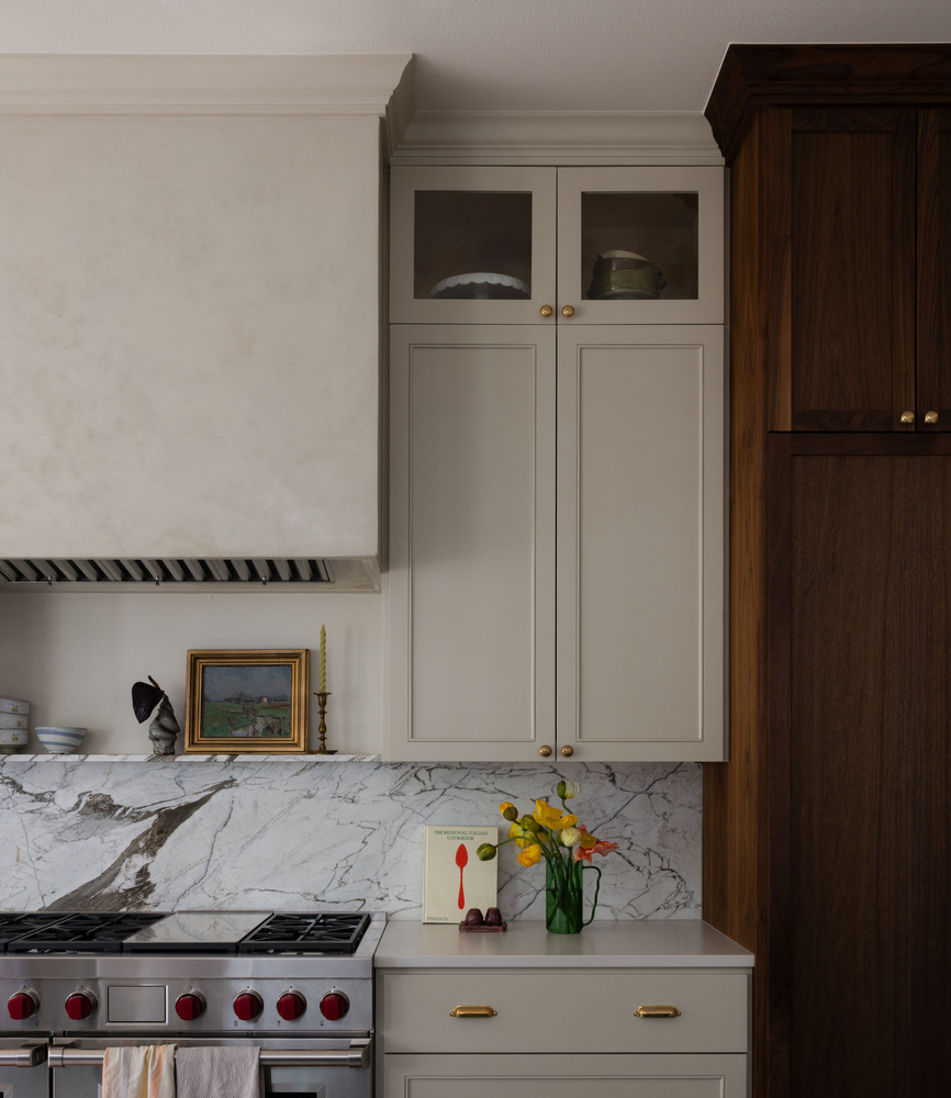 Close-up of remodeled kitchen in Austin TX by RedOven Builds with brass hardware and decorative accents