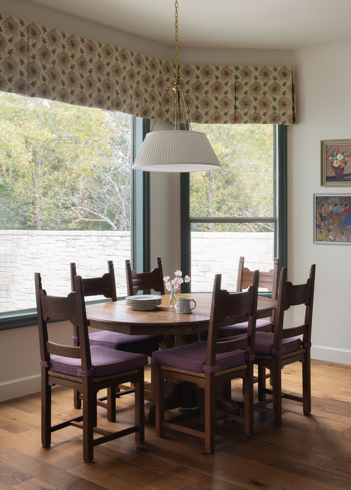 Cozy dining nook in Austin TX full remodel by RedOven Builds featuring natural light and custom seating