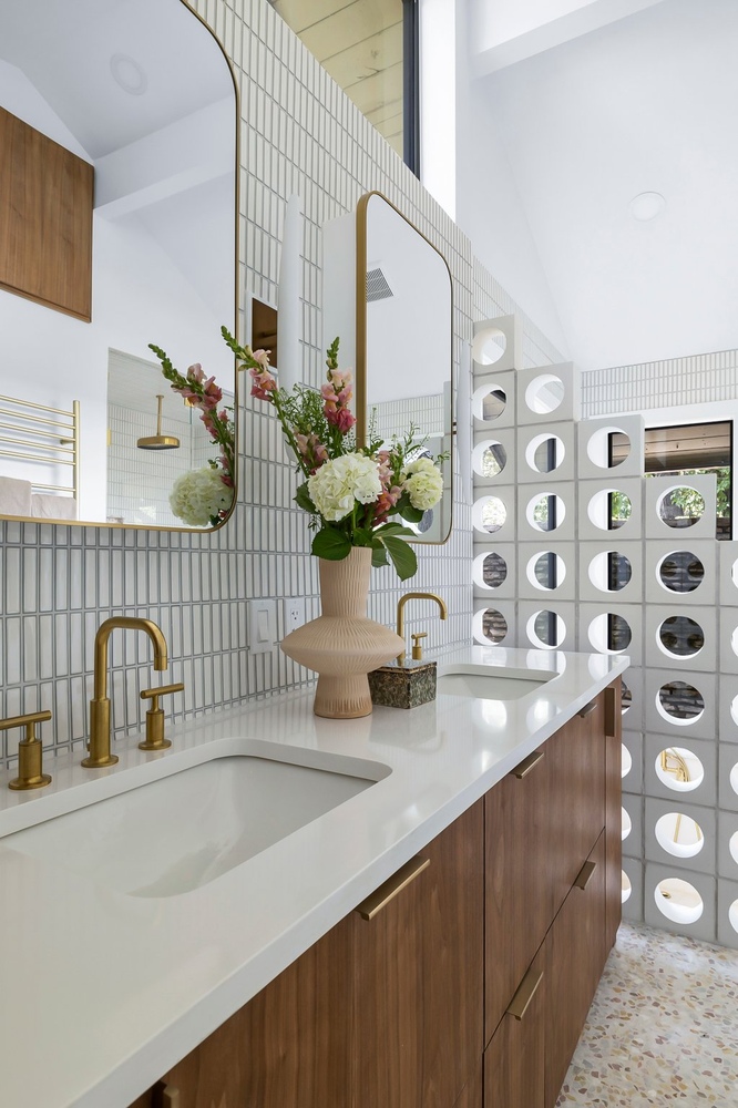 modern bathroom remodel with dual vanity and decorative tile wall by RedOven Builds in Austin, TX